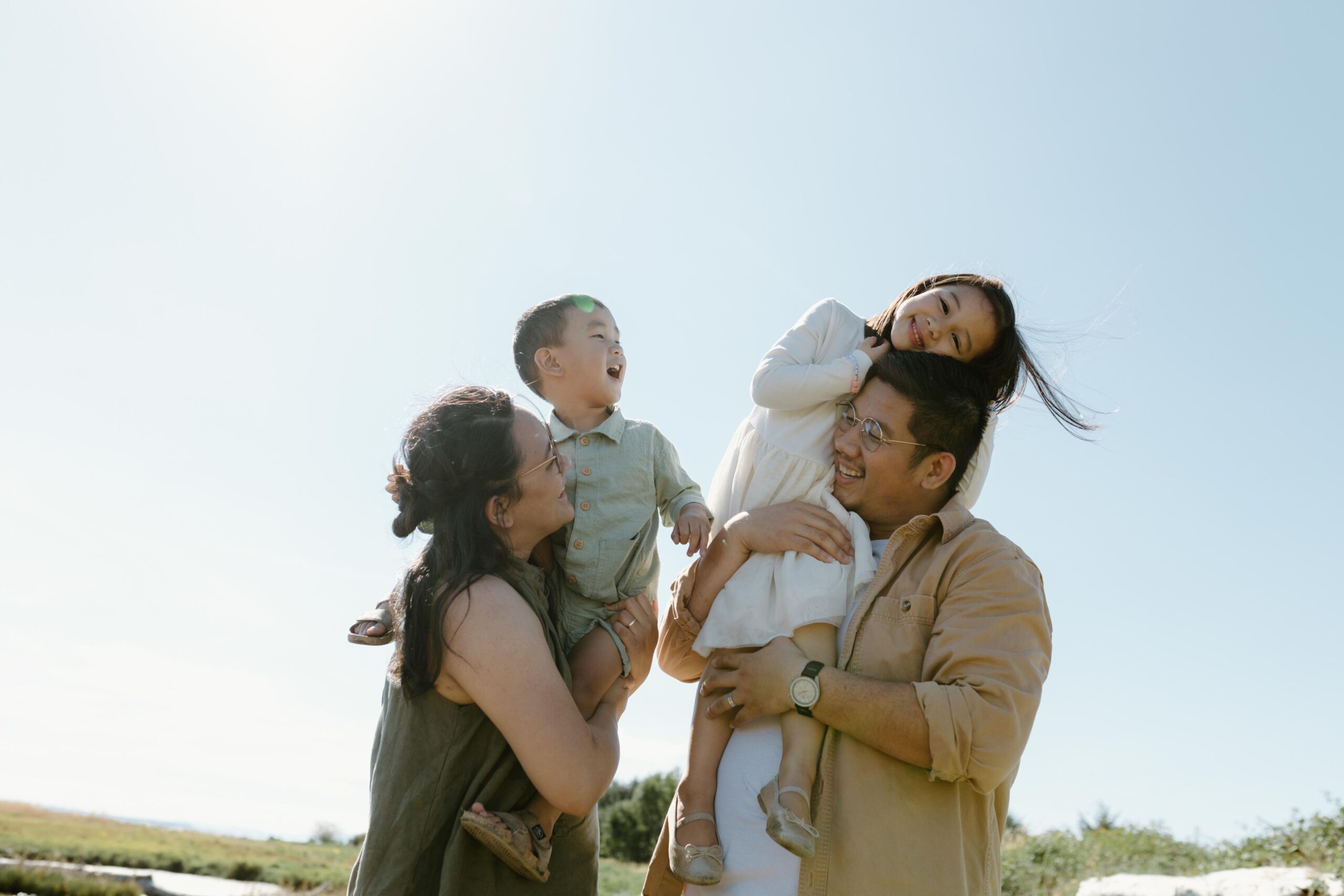 Mom, dad, little girl and little boy smiling