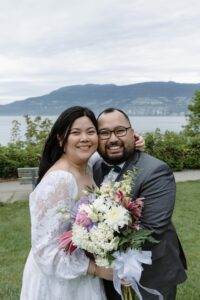 newly married husband and wife hug